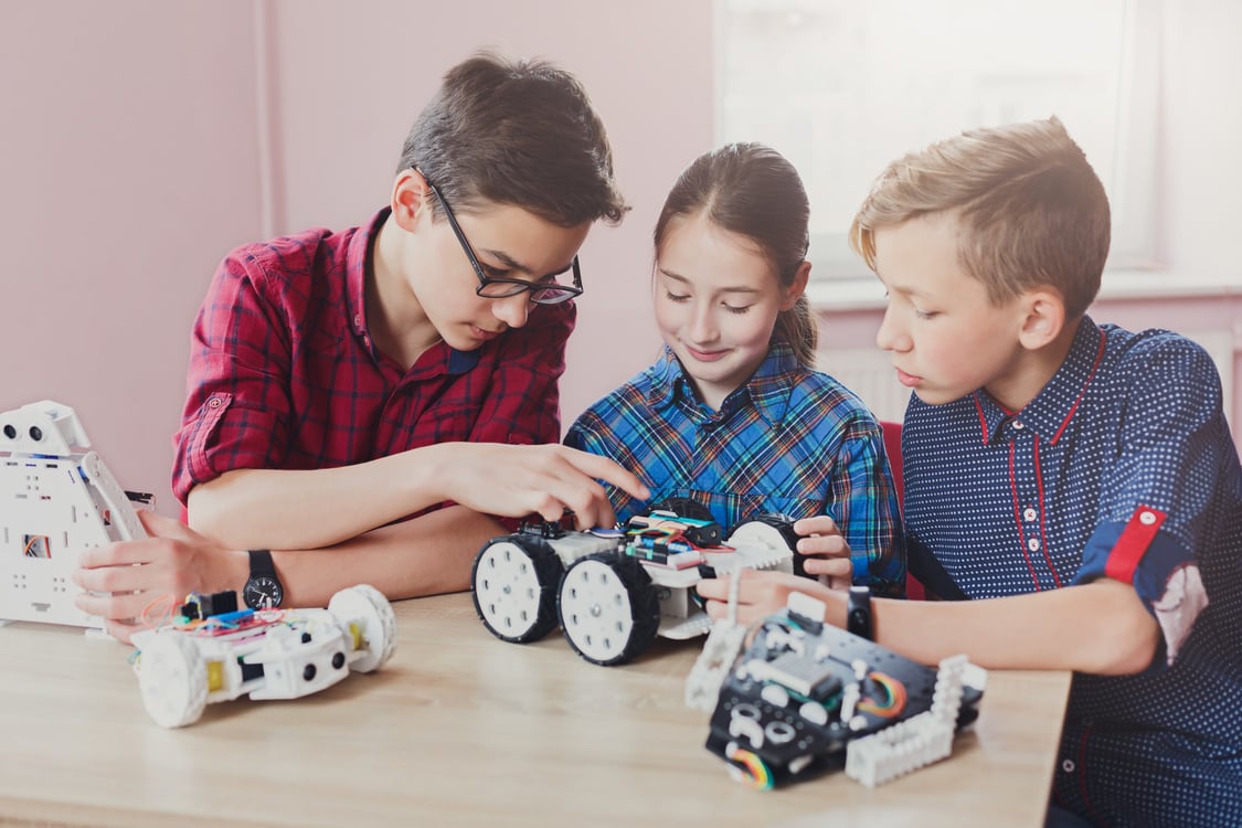 Stem education. Kids creating robots at school